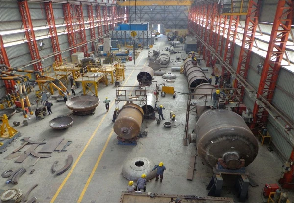 ASME Applicants seeking multiple stamps. Photo showing a fabrication shop with many pressure vessels in production