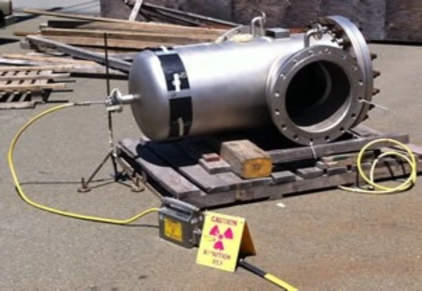 A picture of a pressure vessel under going Radiographic Testing (RT) for U-Stamp Certification